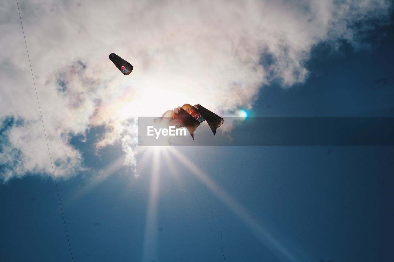 LOW ANGLE VIEW OF KITE IN SKY