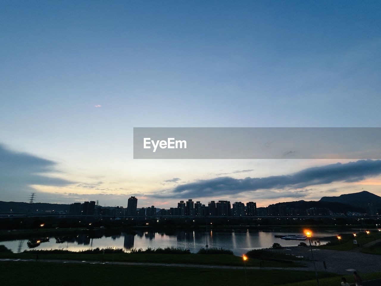 scenic view of river against sky during sunset