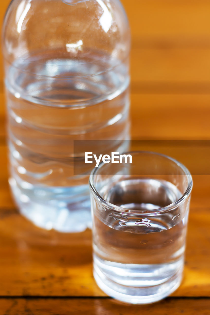 Close-up of drinking water on wooden table