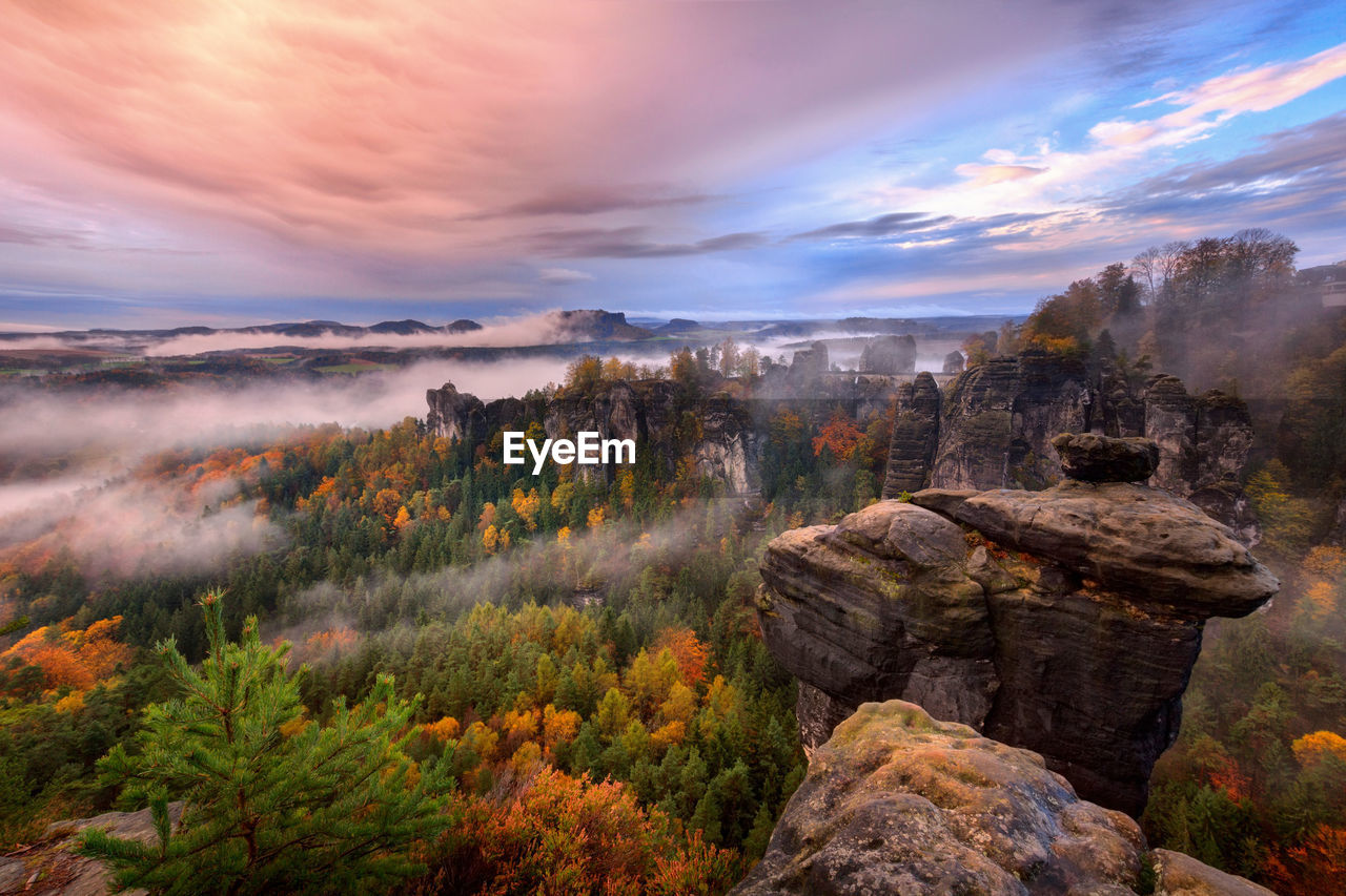 SCENIC VIEW OF ROCKS DURING SUNSET