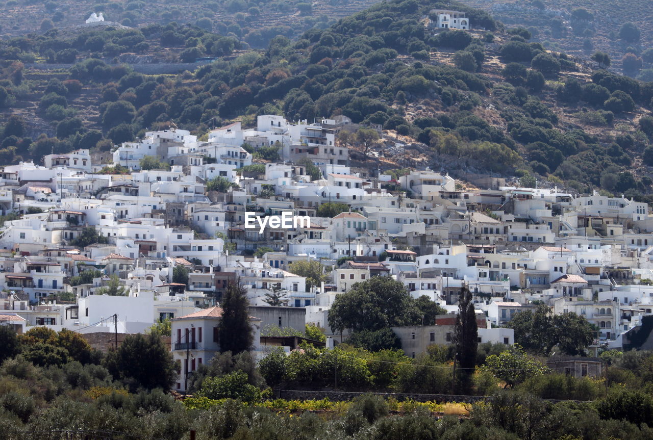 architecture, building exterior, town, built structure, building, aerial photography, city, residential district, tree, plant, high angle view, mountain, nature, house, no people, cityscape, land, environment, landscape, village, day, outdoors, community, mountain range, travel destinations, scenics - nature, beauty in nature, townscape, residential area, tourism, travel, growth