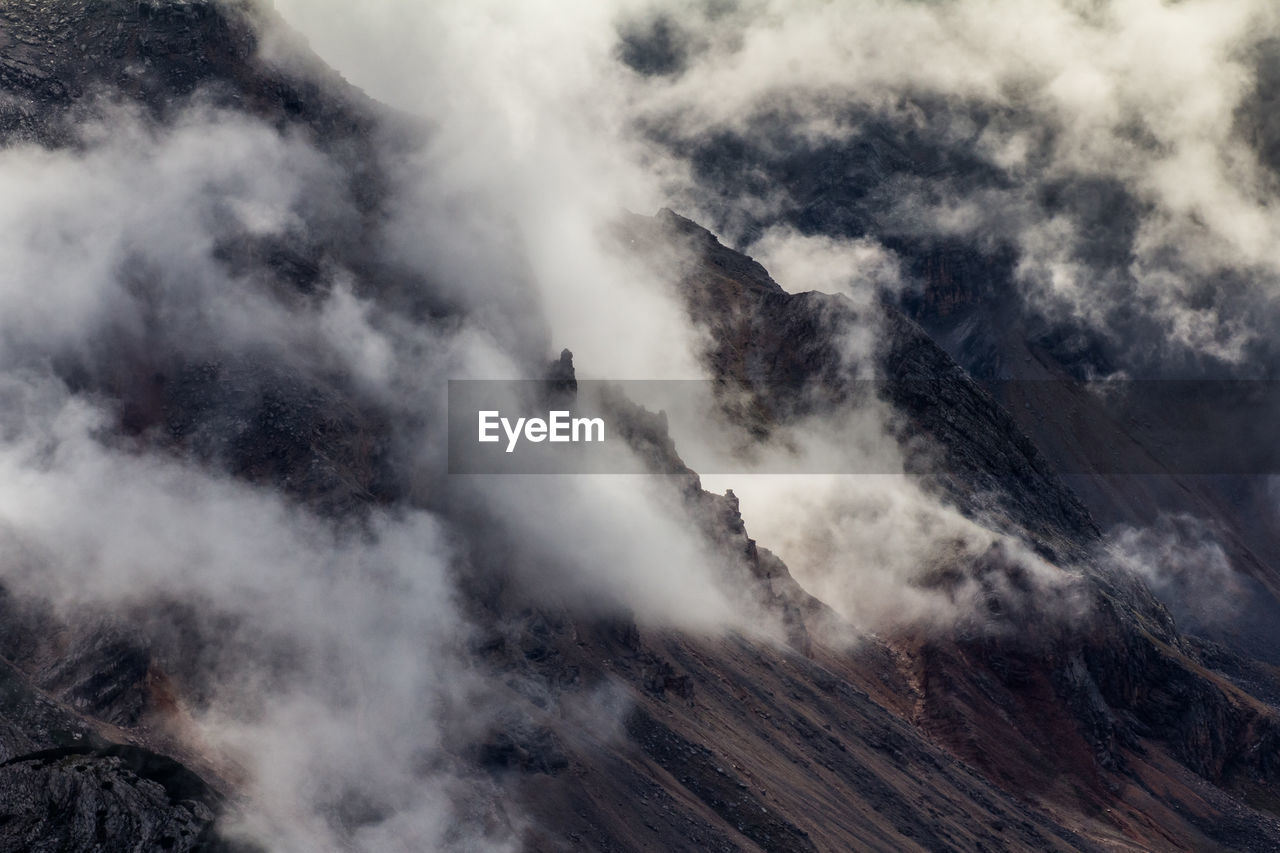 Scenic view of clouds covered mountain