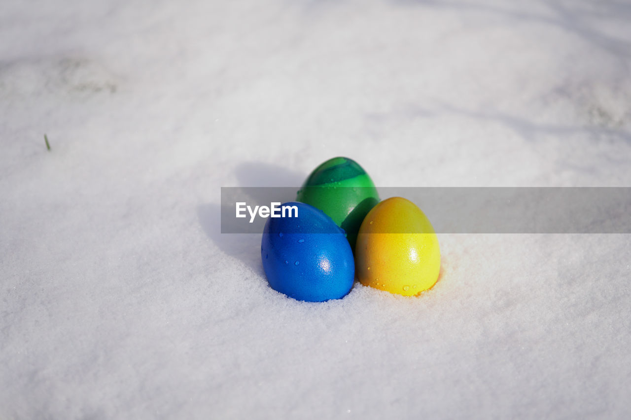 Close-up of colorful easter eggs on snow