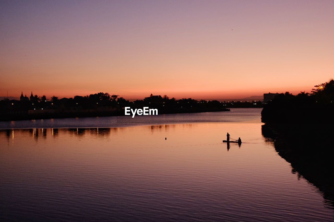 Scenic view of lake against sky during sunset