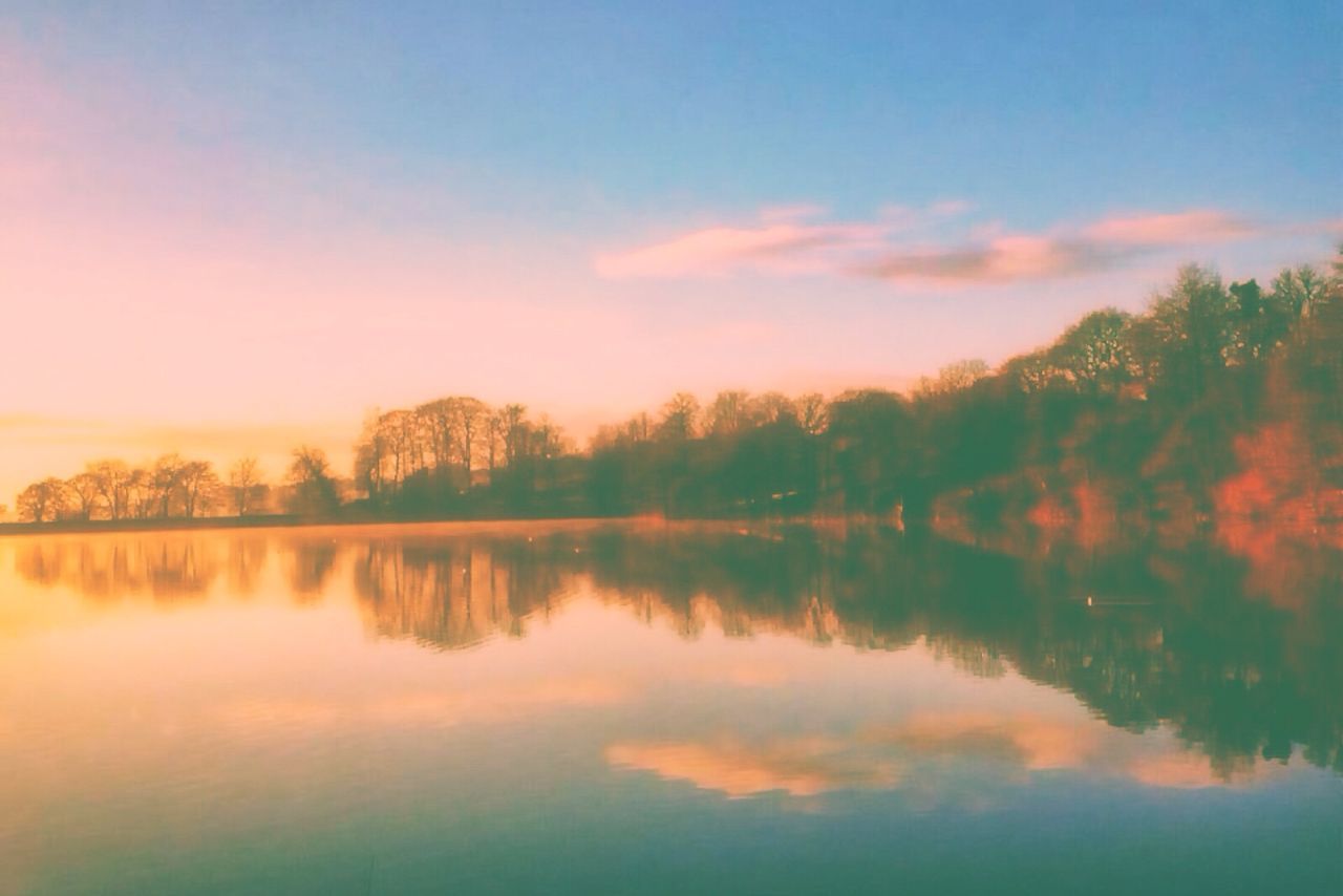 SCENIC VIEW OF LAKE AT SUNSET