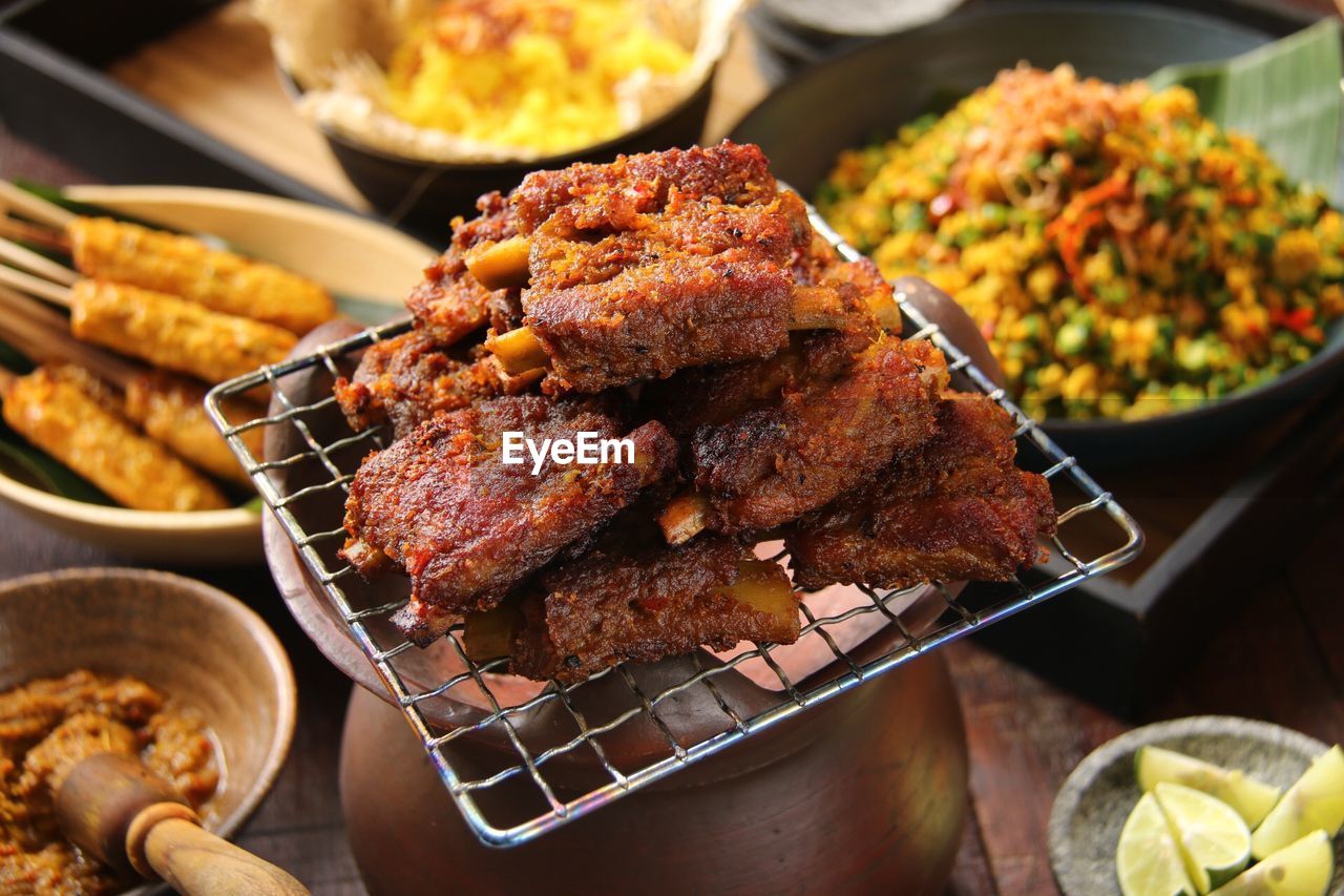 High angle view of meat on grill