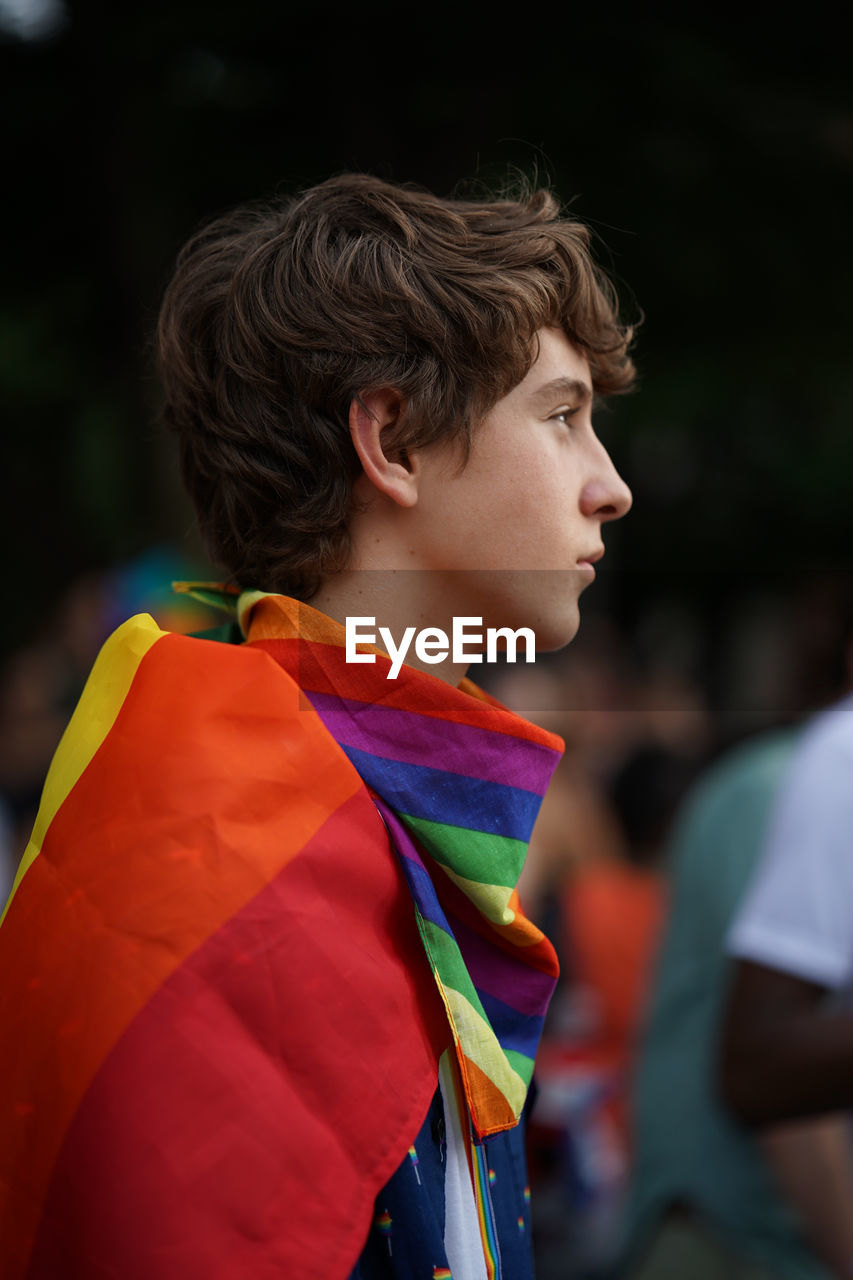 PORTRAIT OF BOY WITH MULTI COLORED PENCILS