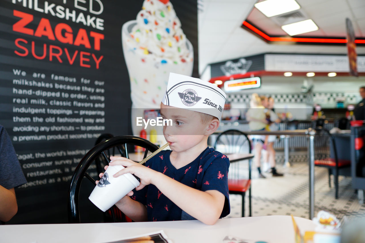 PORTRAIT OF BOY WITH ICE CREAM