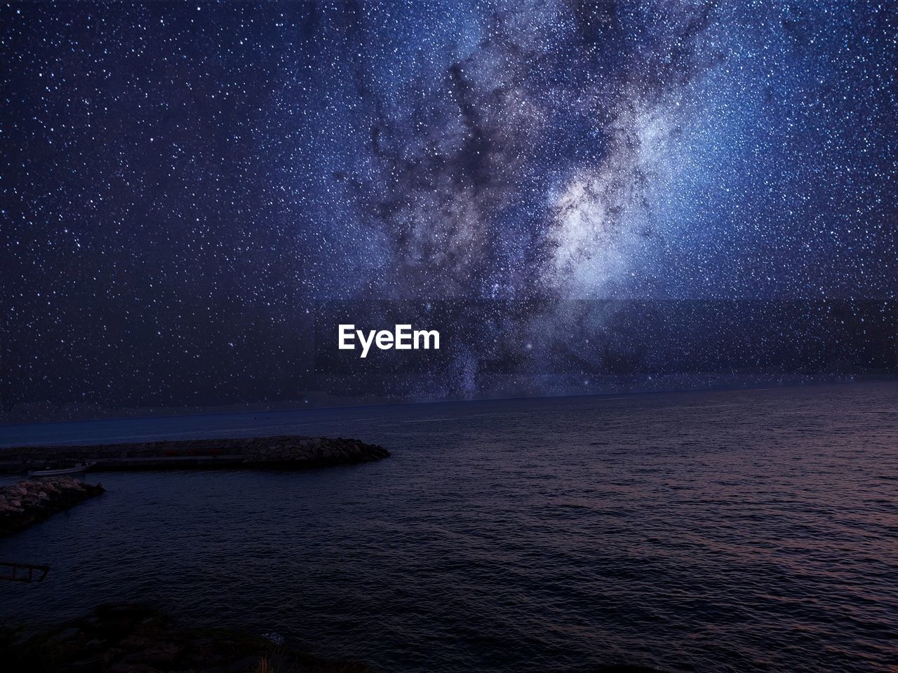 Scenic view of sea against sky at night