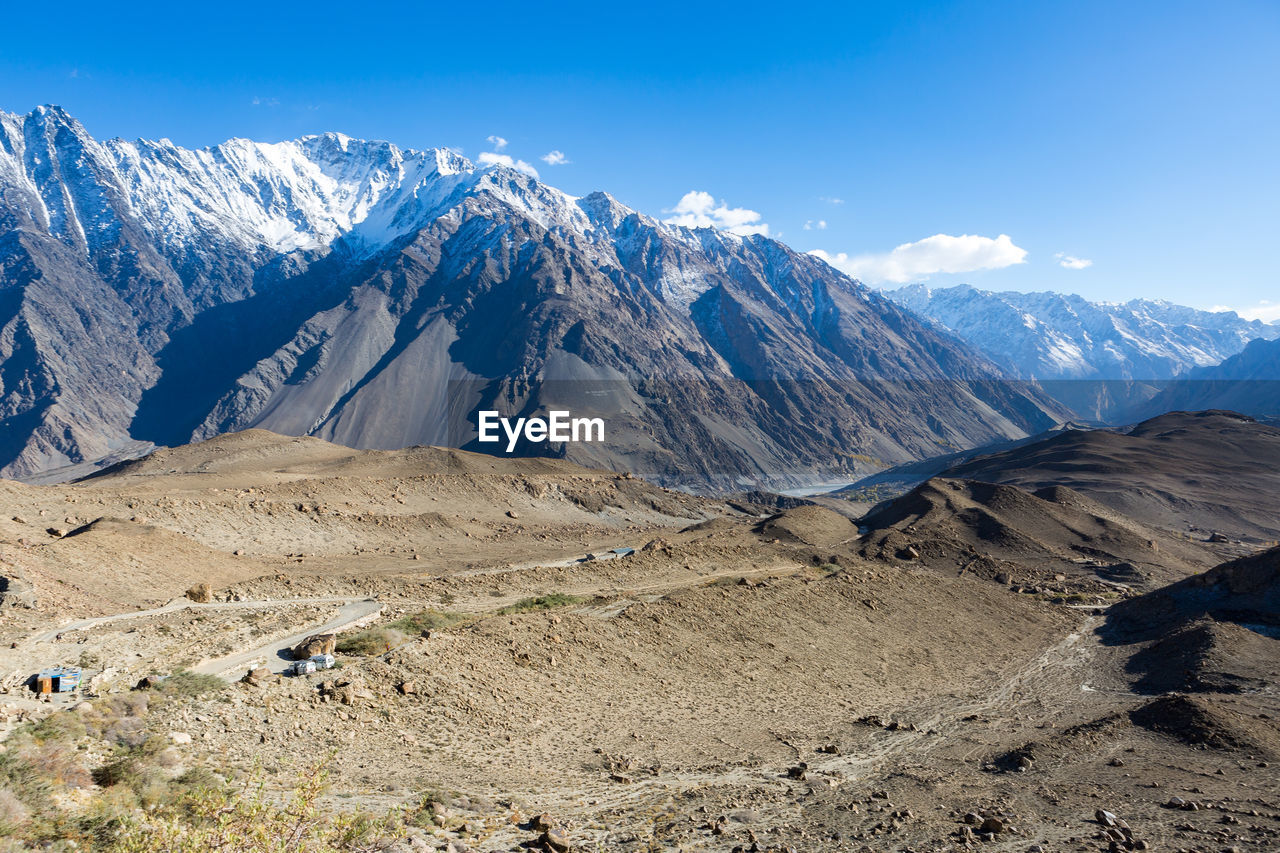 Scenic view of snowcapped mountains against sky