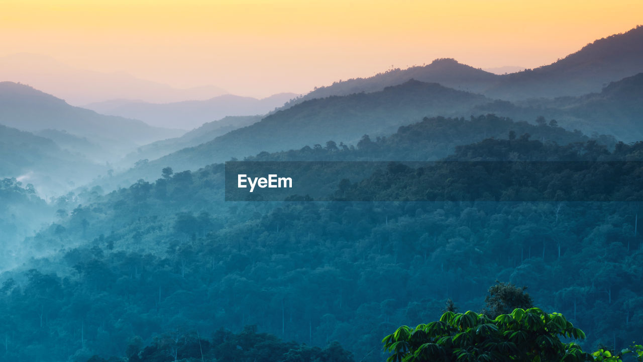 Scenic view of mountains against sky during sunset