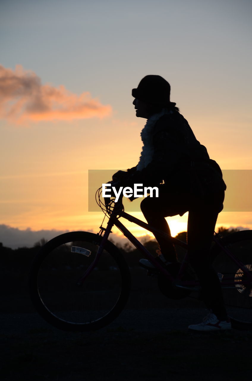 Silhouette person at sunset