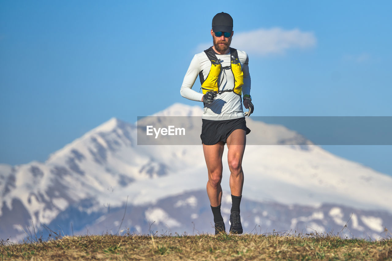Man travel athlete in the mountains in high altitude