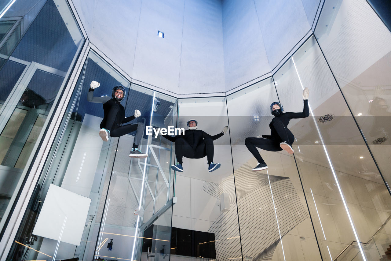 Athletes flying in wind tunnel