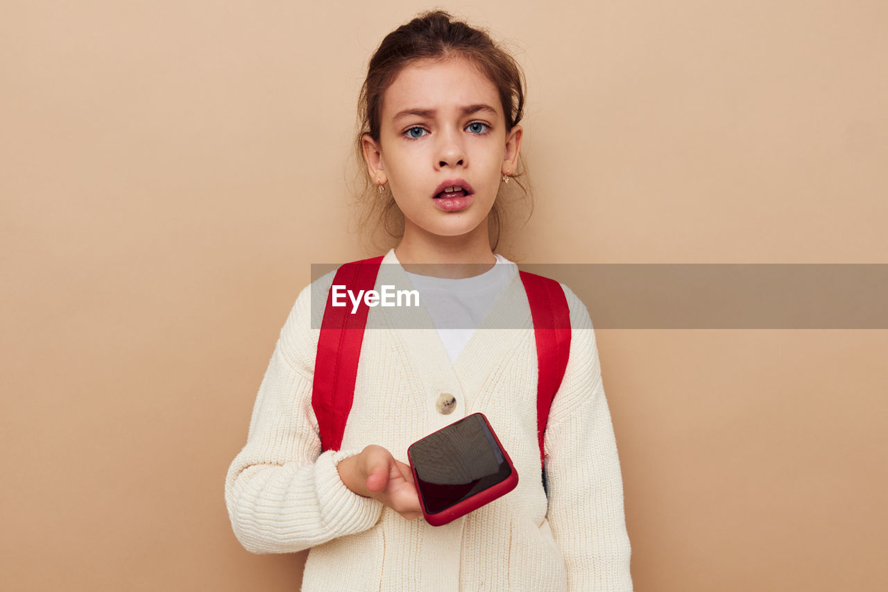 portrait of young woman using smart phone