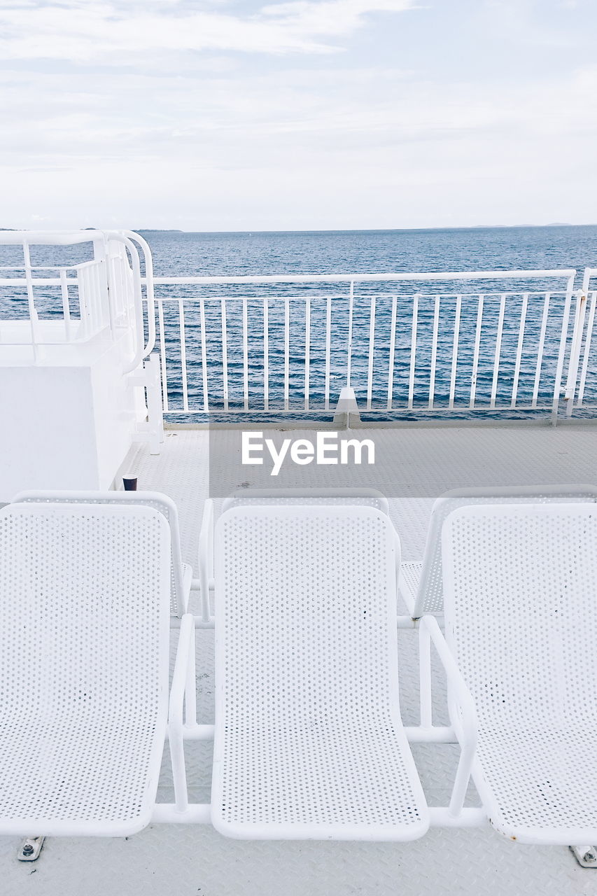 White chairs on boat deck