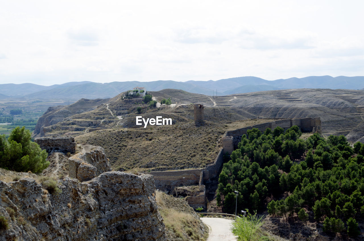 VIEW OF LANDSCAPE AGAINST CLOUDY SKY