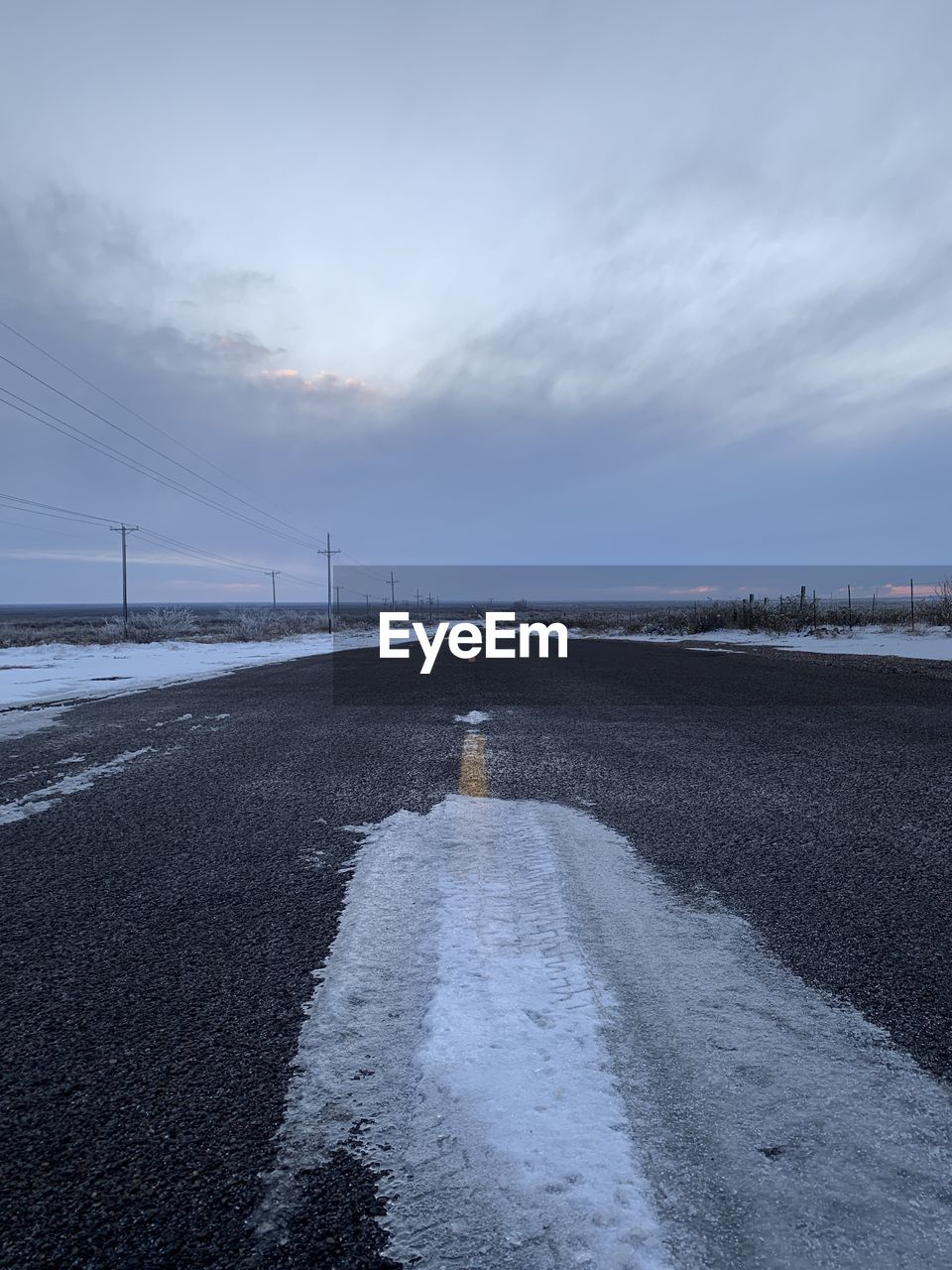 SURFACE LEVEL VIEW OF ROAD AGAINST SKY