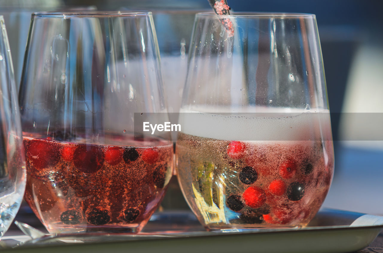 Sparkling wine with frozen berries