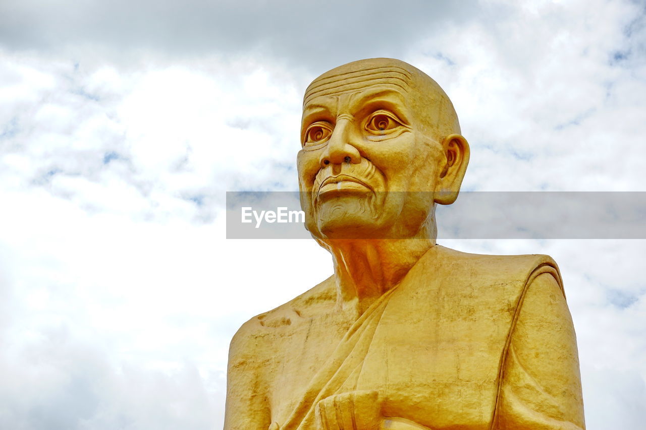 Low angle view of statue against sky