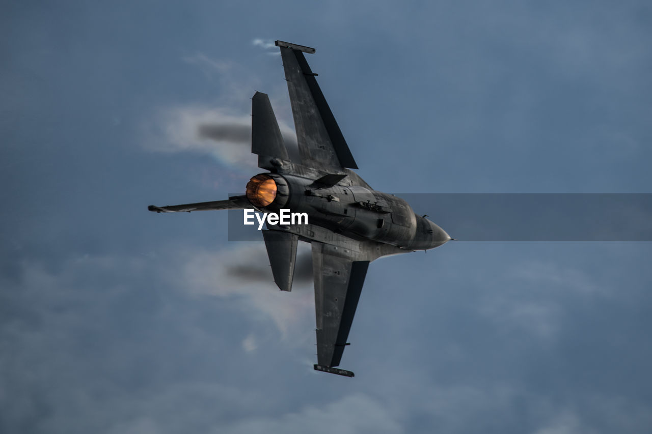 LOW ANGLE VIEW OF AIRSHOW AGAINST SKY