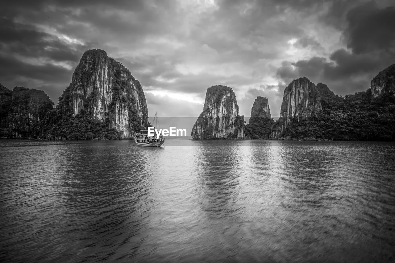 Scenic view of sea and rocks against sky