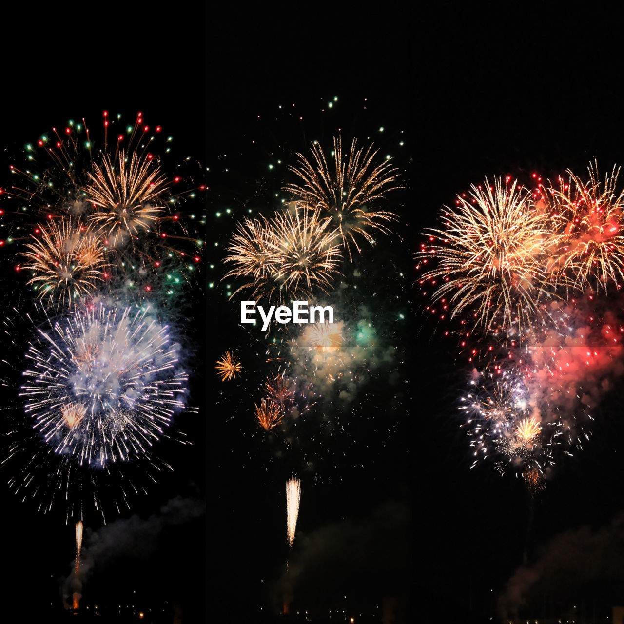 Low angle view of firework display at night