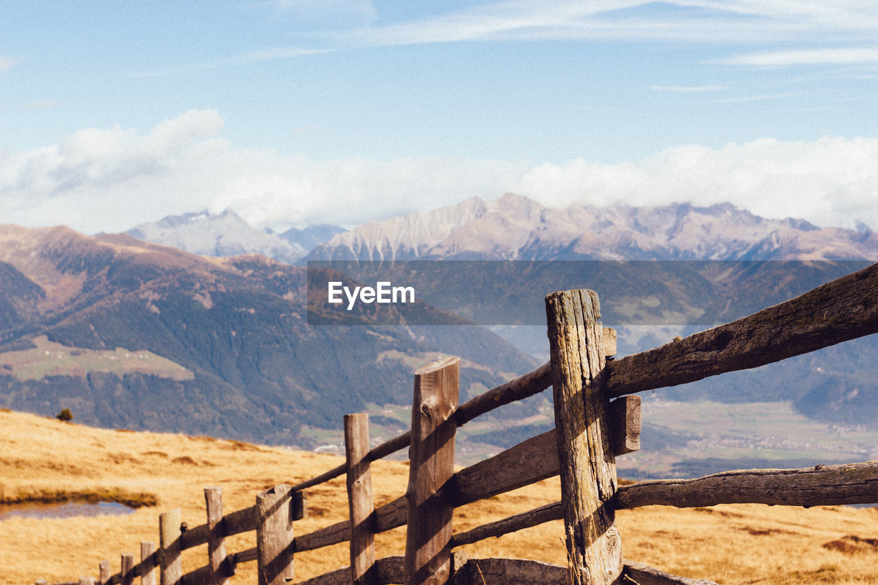 Scenic view of wooden post against sky