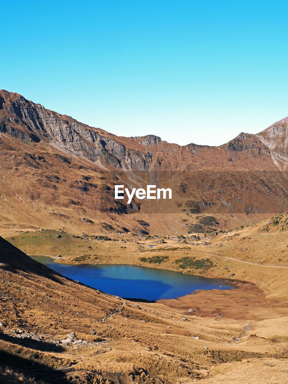 Pond amidst mountains