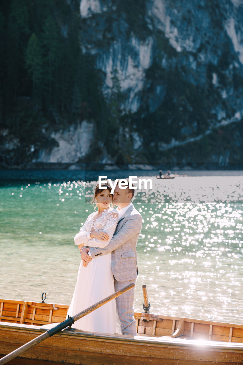 Couple standing by water