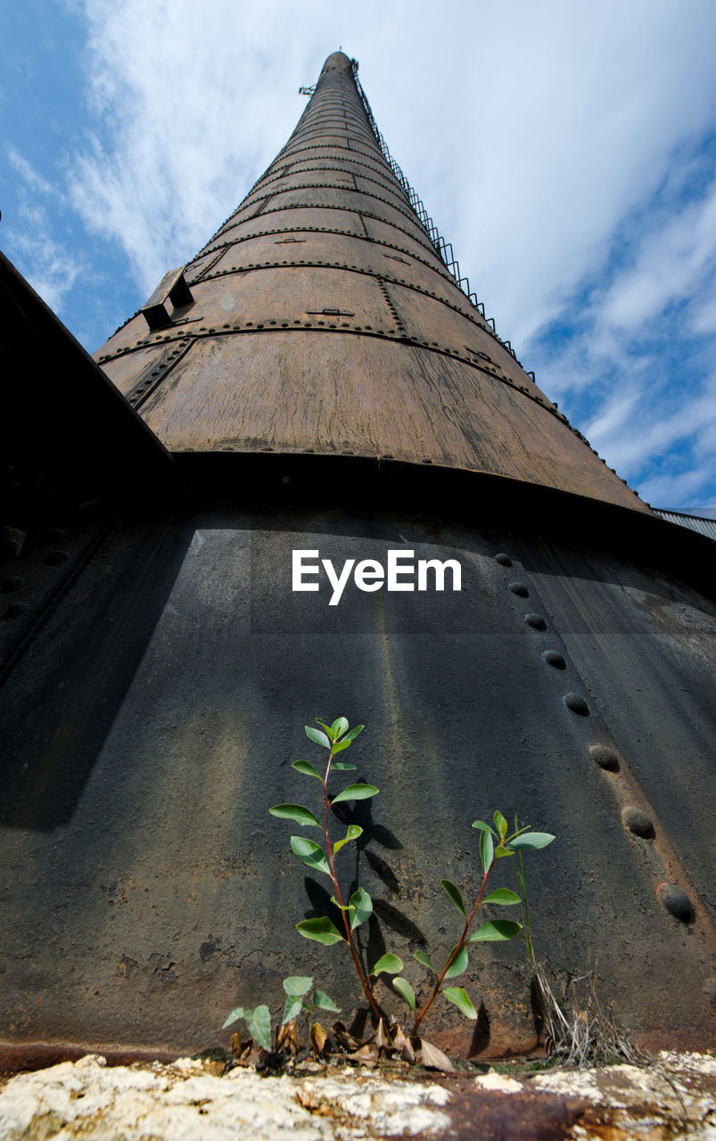 Old power house tower against cirrus sky