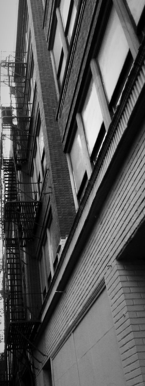 LOW ANGLE VIEW OF STAIRS AND BUILDINGS