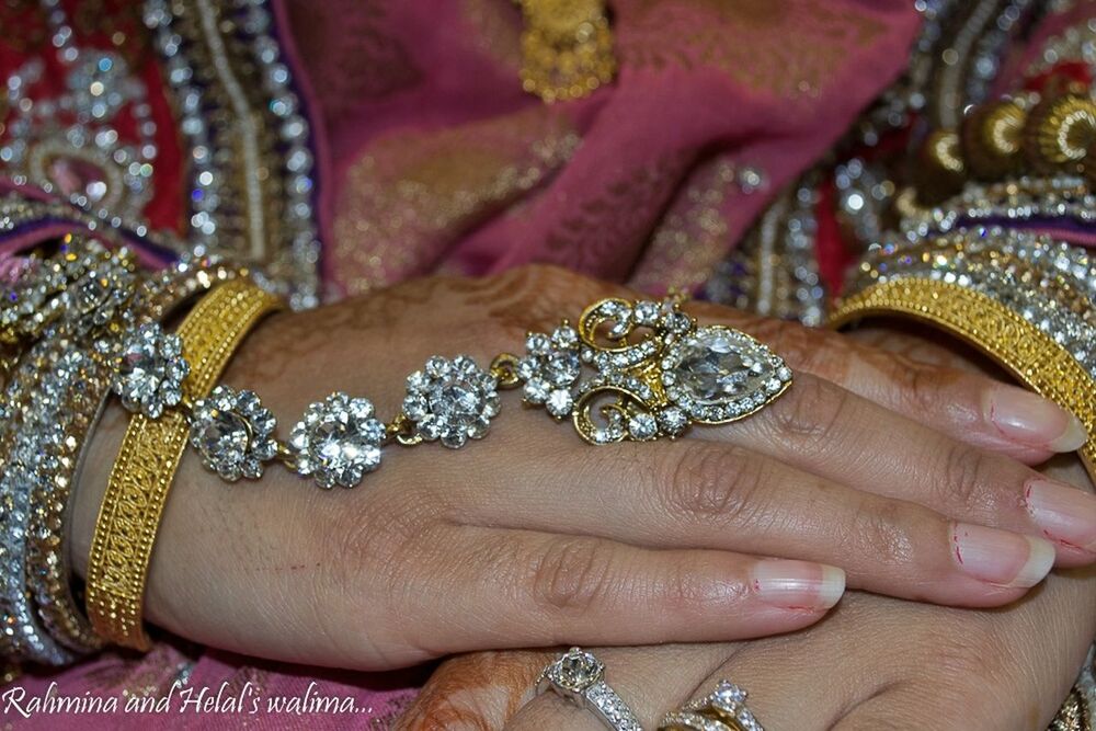 Close-up mid section of an indian brides hands