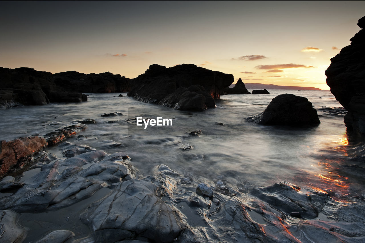 View of beach at sunset