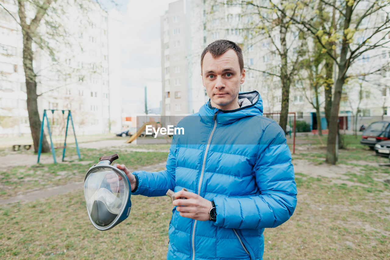 Portrait of man standing outdoors