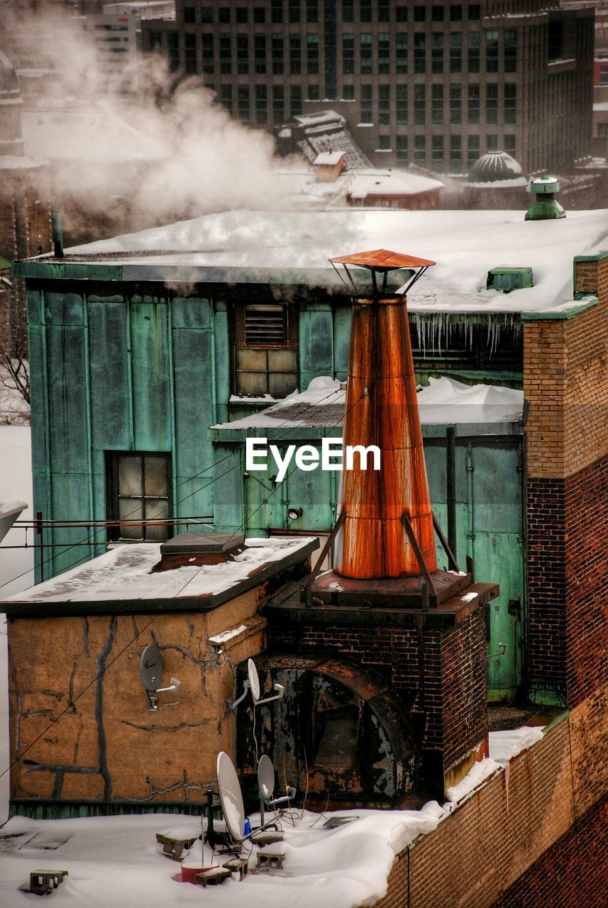 Smoke emitting from chimney during winter