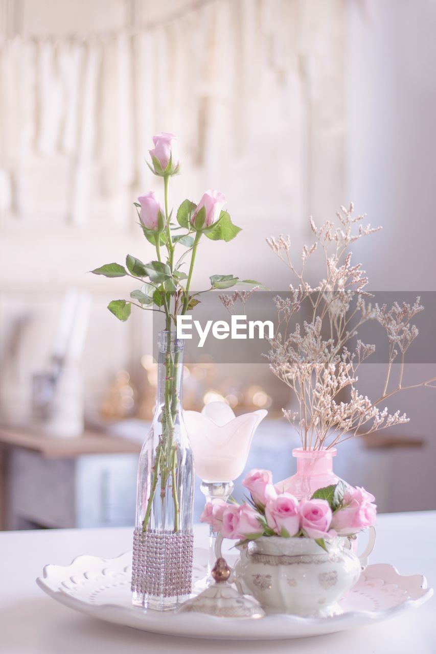 Flowers in vase on table at home