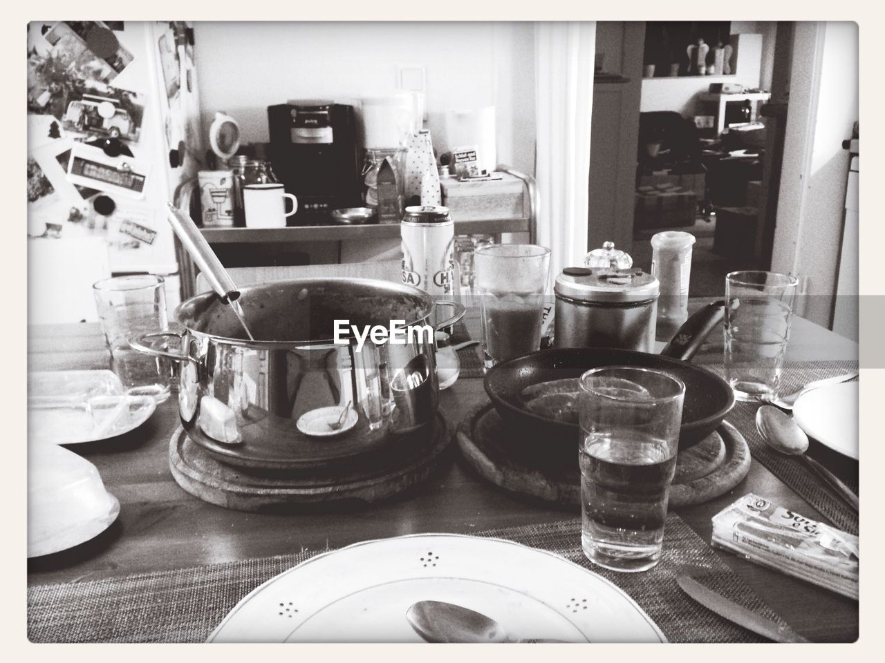 Utensils and plates with glasses on table