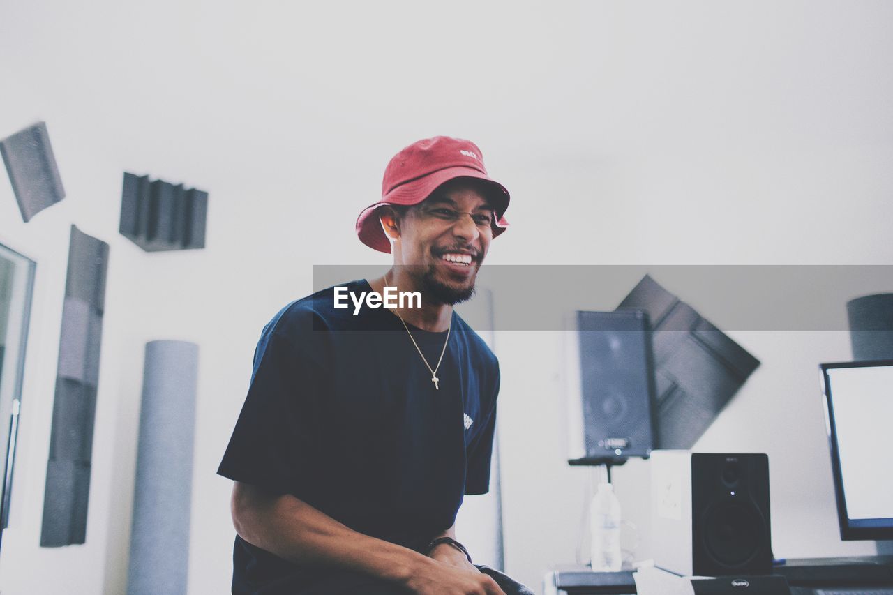 Smiling man looking away in studio
