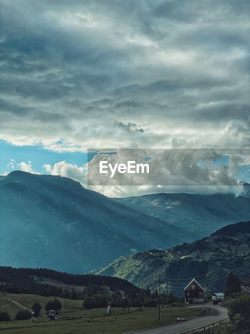 SCENIC VIEW OF LAND AND MOUNTAINS AGAINST SKY