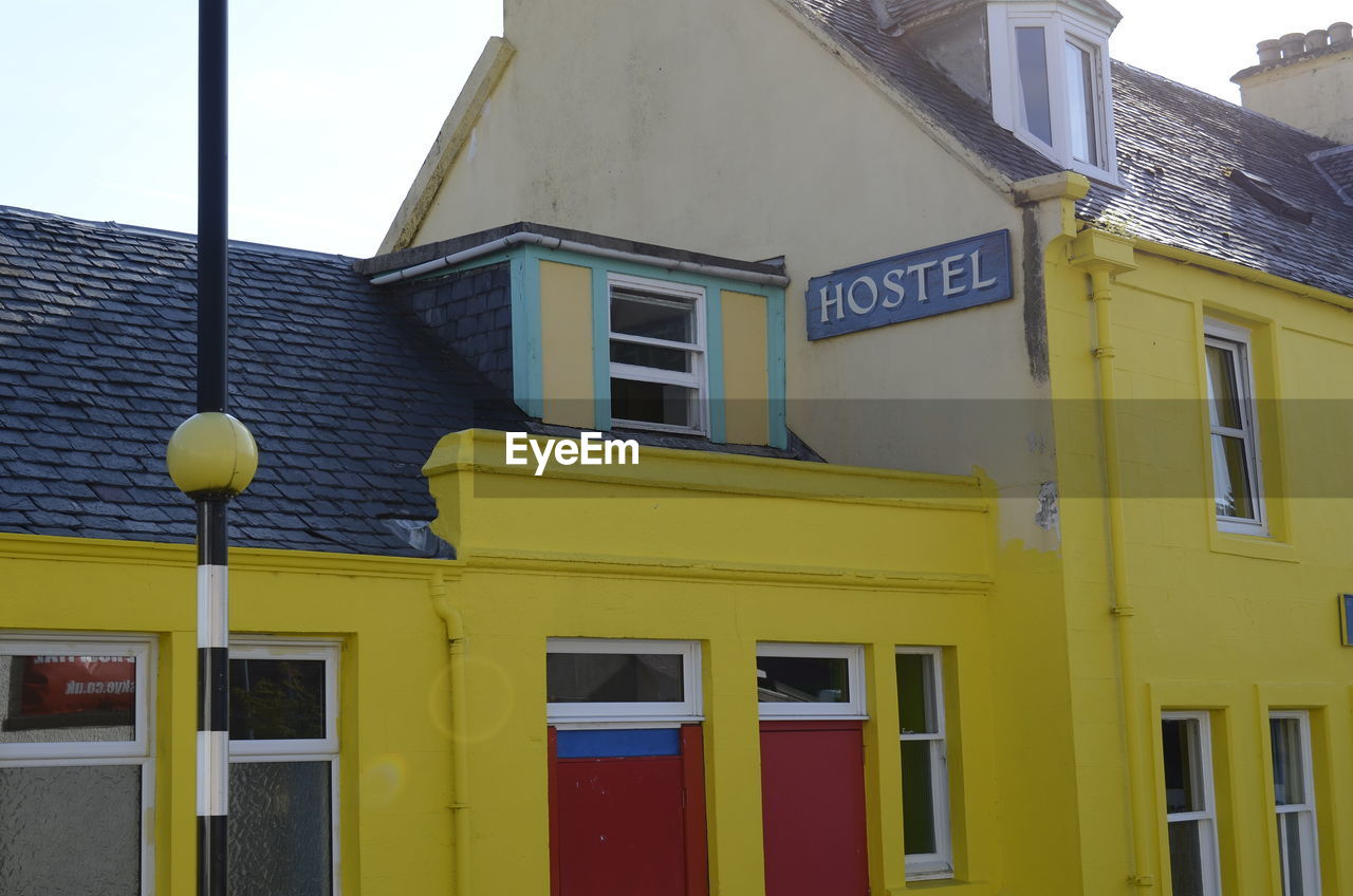 CLOSE-UP OF YELLOW BUILDINGS