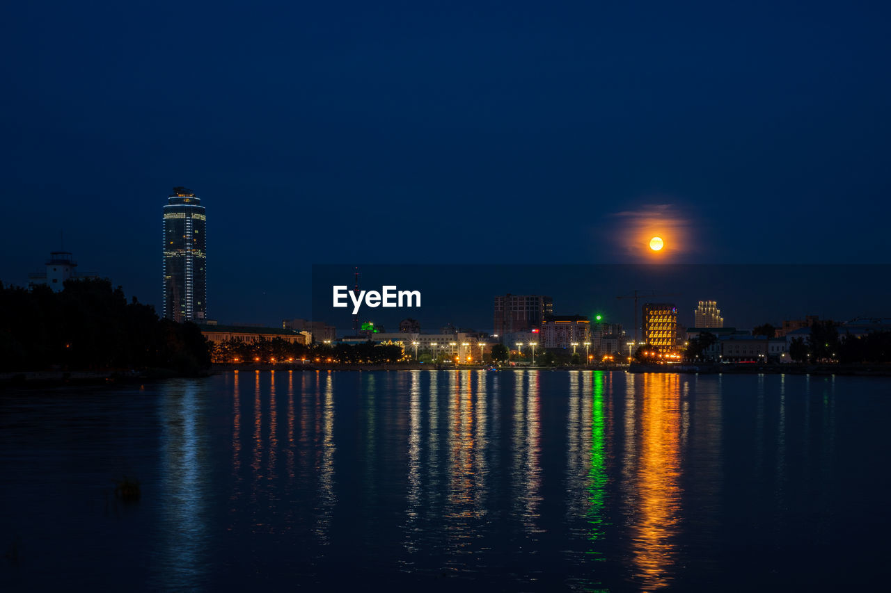 View of the embankment in yekaterinburg on a full moon