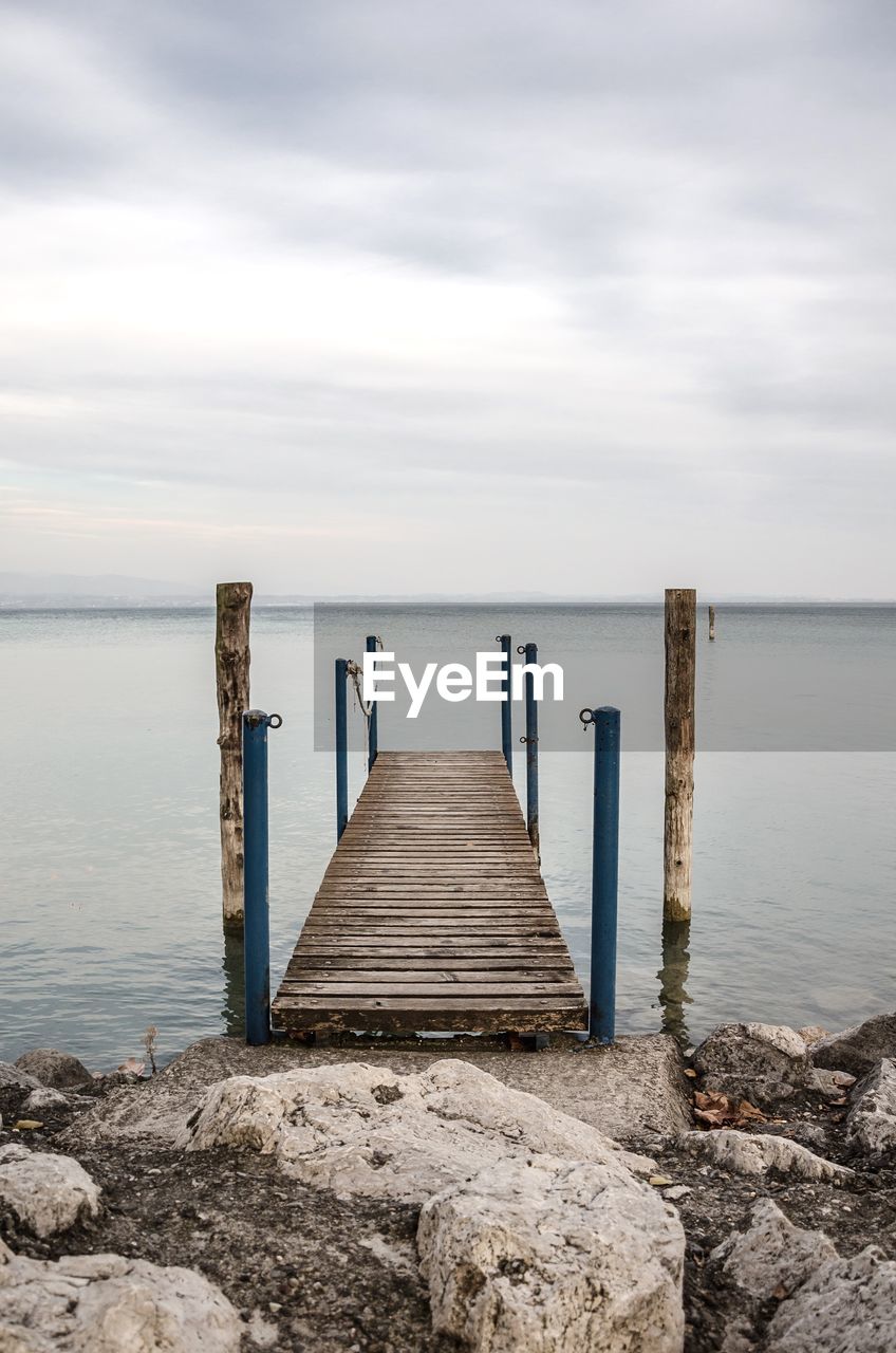 Pier over sea against sky