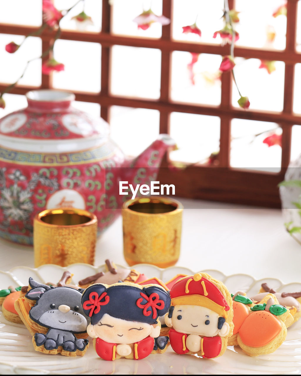 Chinese new year imlek icing sugar cookies character.