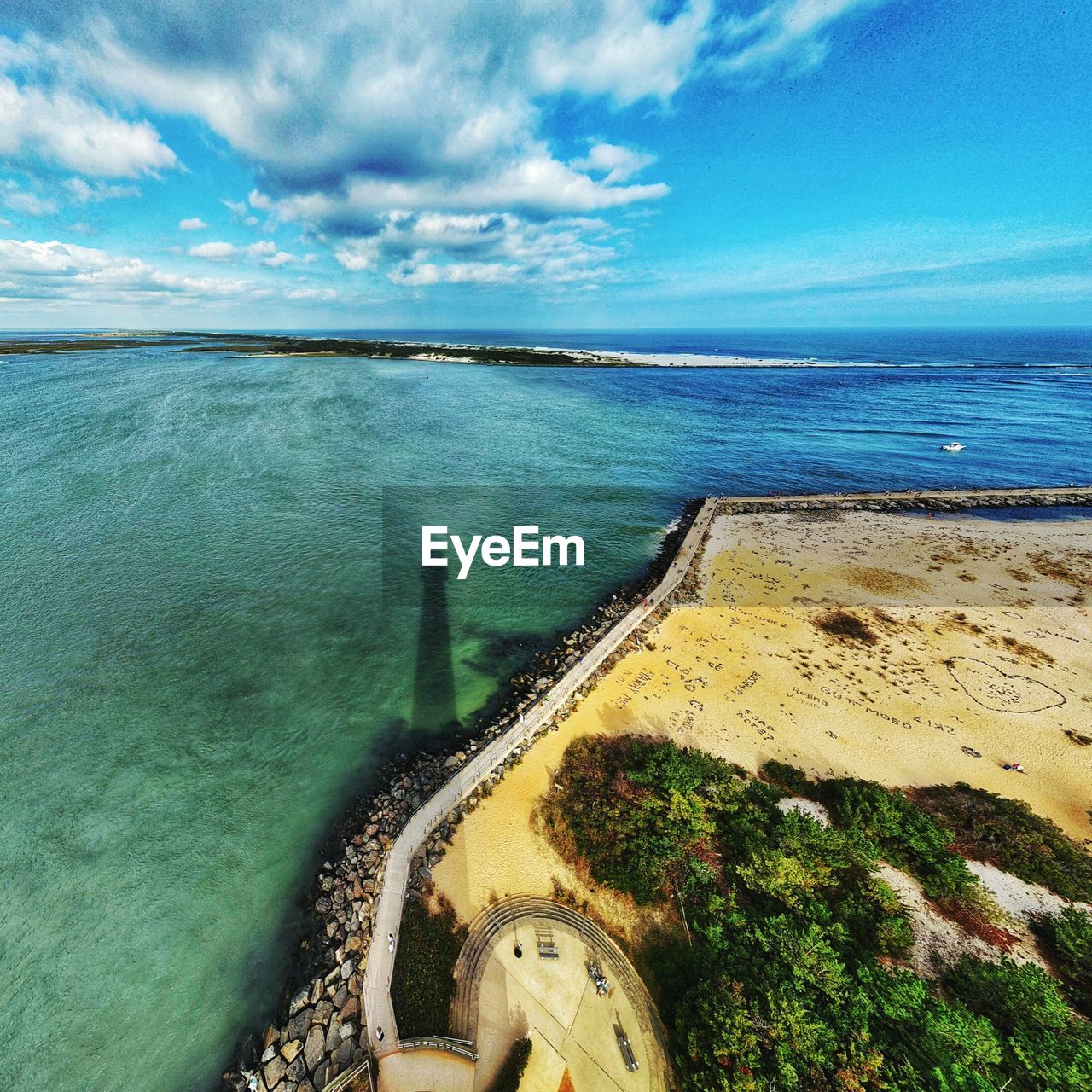 SCENIC VIEW OF SEA SHORE AGAINST SKY