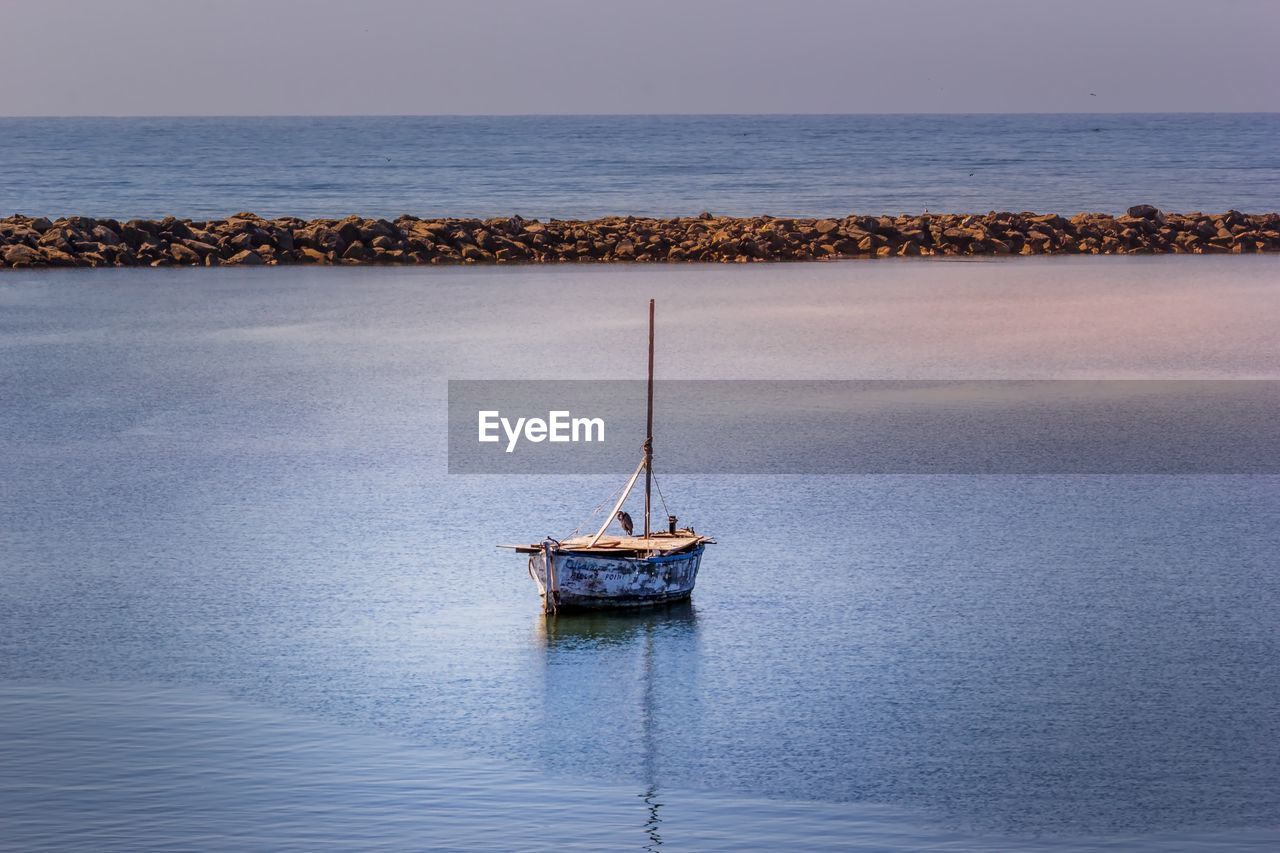 Ship in sea against sky