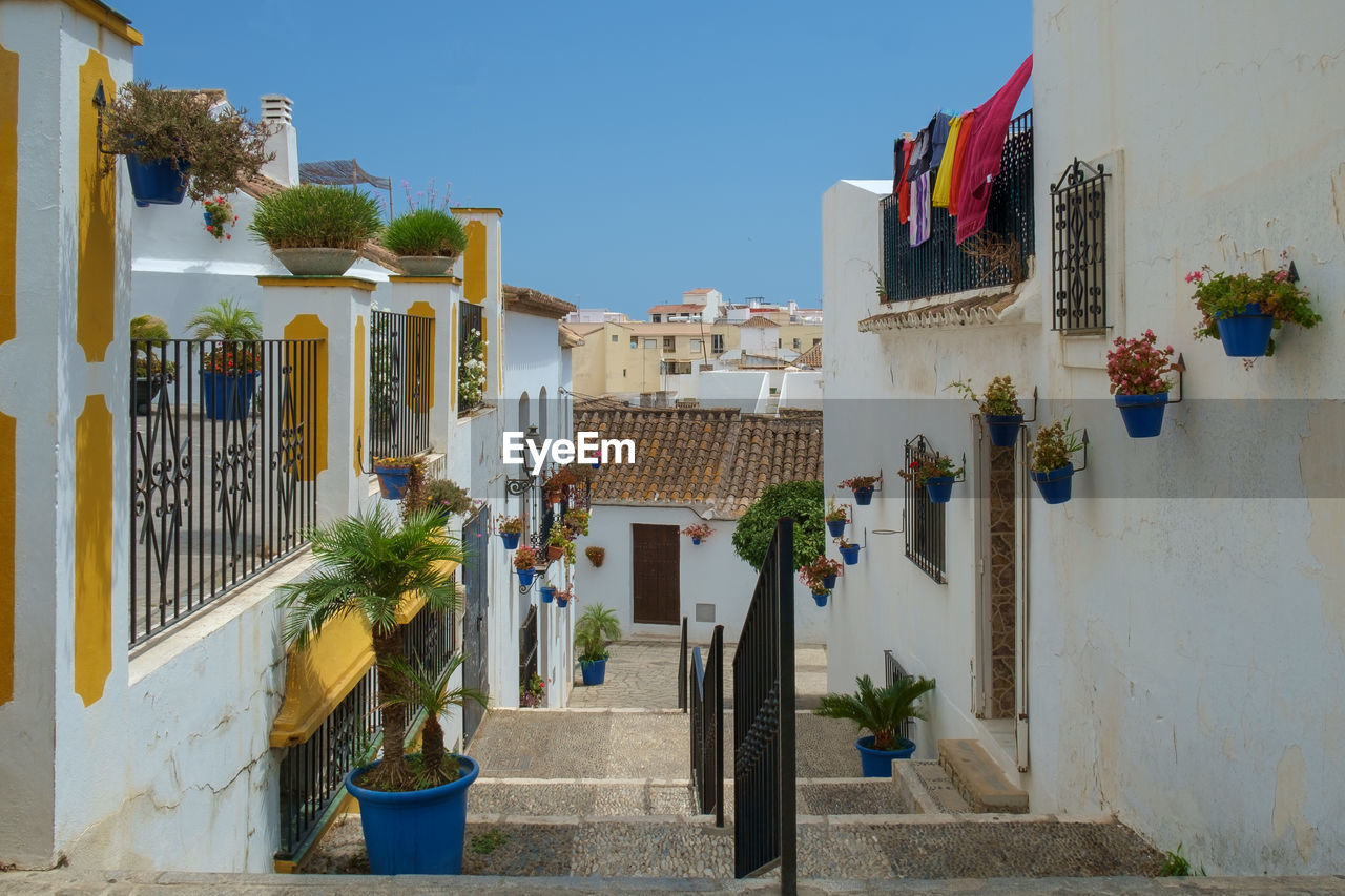 The narrow streets of estepona, spain, each street has flower pots of a different colour.