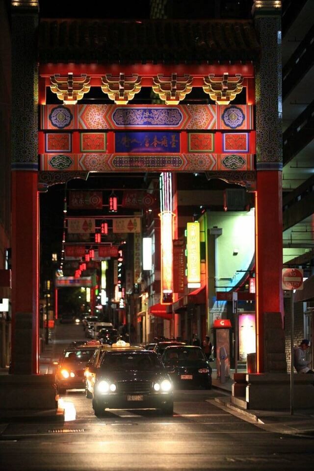 NIGHT VIEW OF ILLUMINATED CITY STREET