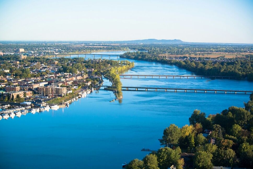 RIVER WITH CITYSCAPE IN BACKGROUND