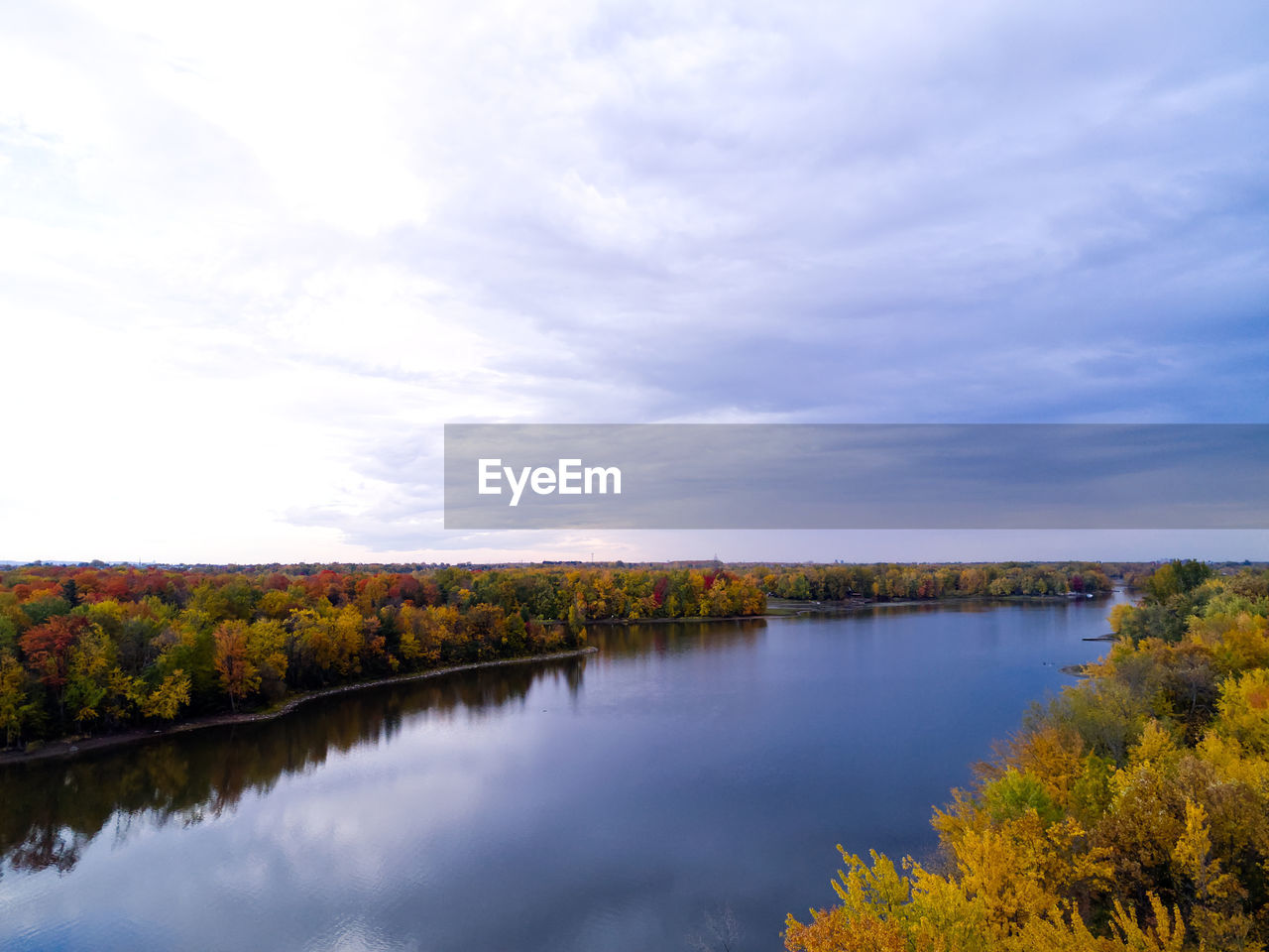 Scenic view of lake against sky during autumn